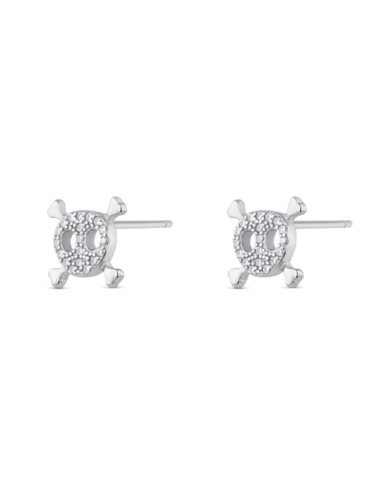 Los pendientes de plata y circonitas con forma de calavera son una elección audaz y estilizada. Hechos de plata de ley, ofrecen 