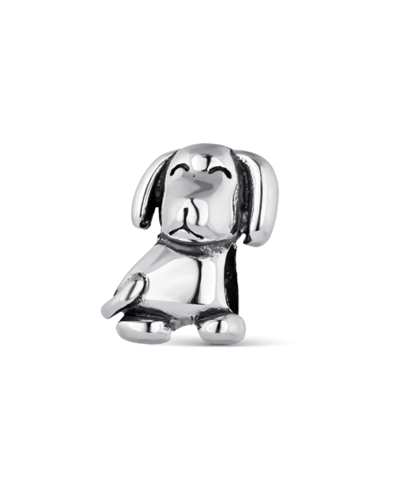 Un encantador perrito elaborado en plata de ley, detalladamente diseñado para capturar la esencia y la ternura de tu amigo pelud