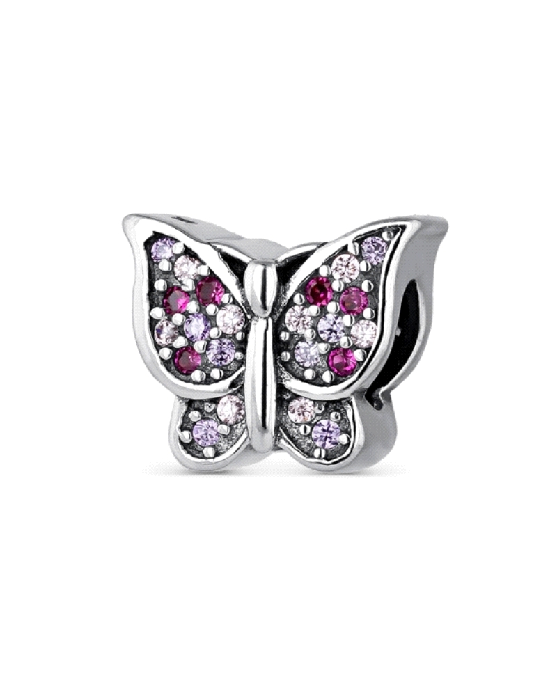 Una exquisita mariposa elaborada en plata de ley, adornada con circonitas de colores brillantes. Cada circonita, cuidadosamente 