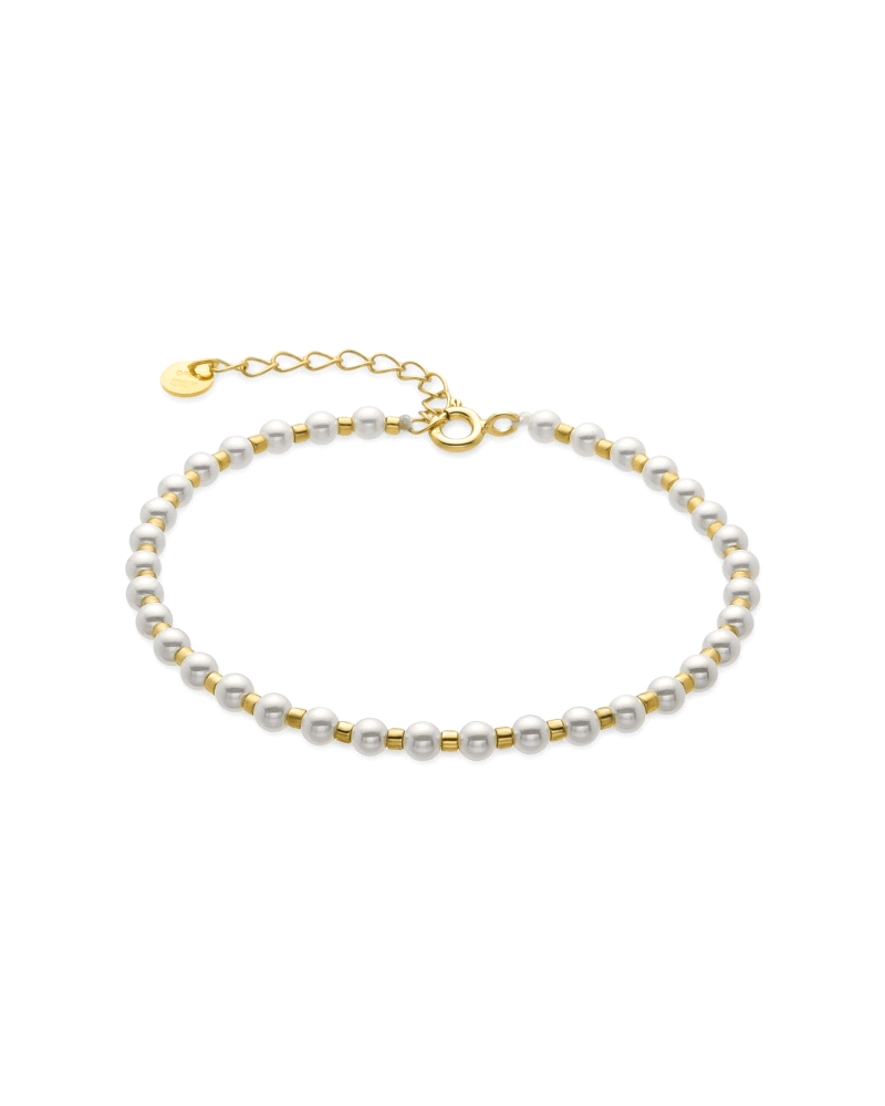 Pulsera de plata de ley 925 y perla blanca acabada en oro amarillo de 18k. Atelier transmite tendencia en cada joya, con diseños