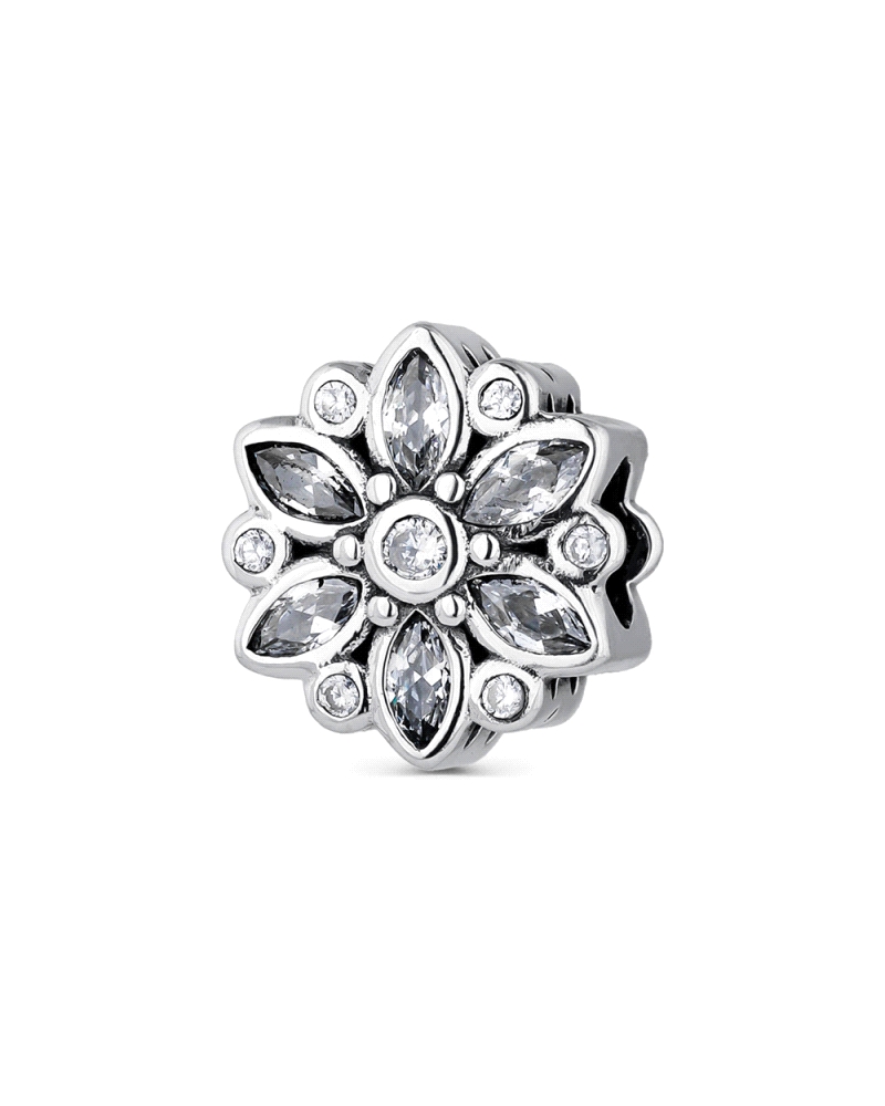 Abalorio de plata en forma de flor gris destaca por su diseño delicado y sofisticado. Inspirado en la belleza natural, su acabad