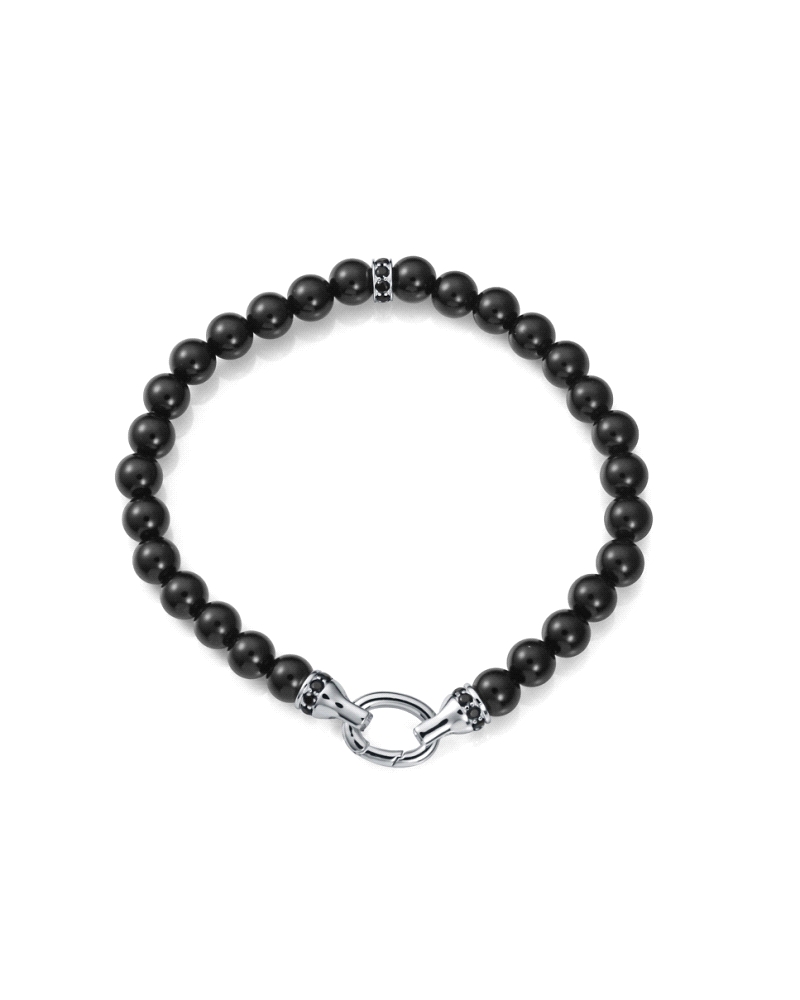 Una pulsera que combina elegancia y sofisticación con un toque de misterio. Fabricada en plata de primera ley con un baño de rod