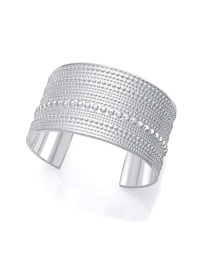 Esta pulsera rígida abierta de acero chapado en plata 999 es una pieza elegante y moderna que resalta en cualquier ocasión. Con 